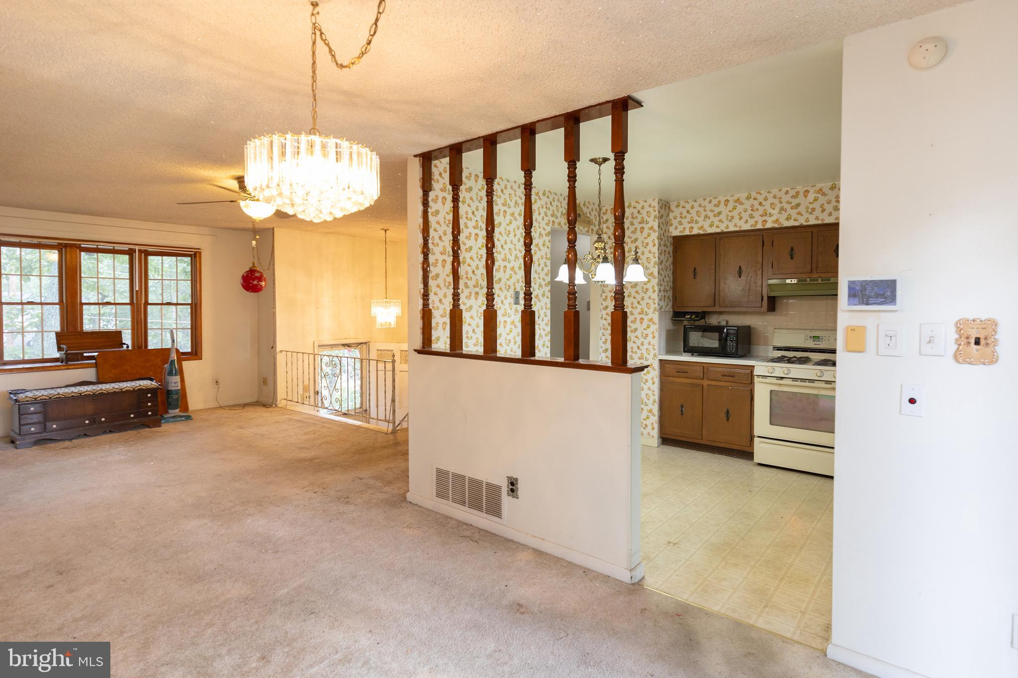 78 Diamond Avenue Pine Hill, NJ 08021 - Photo 22 of 36 a view of a kitchen with a sink cabinets and a large window