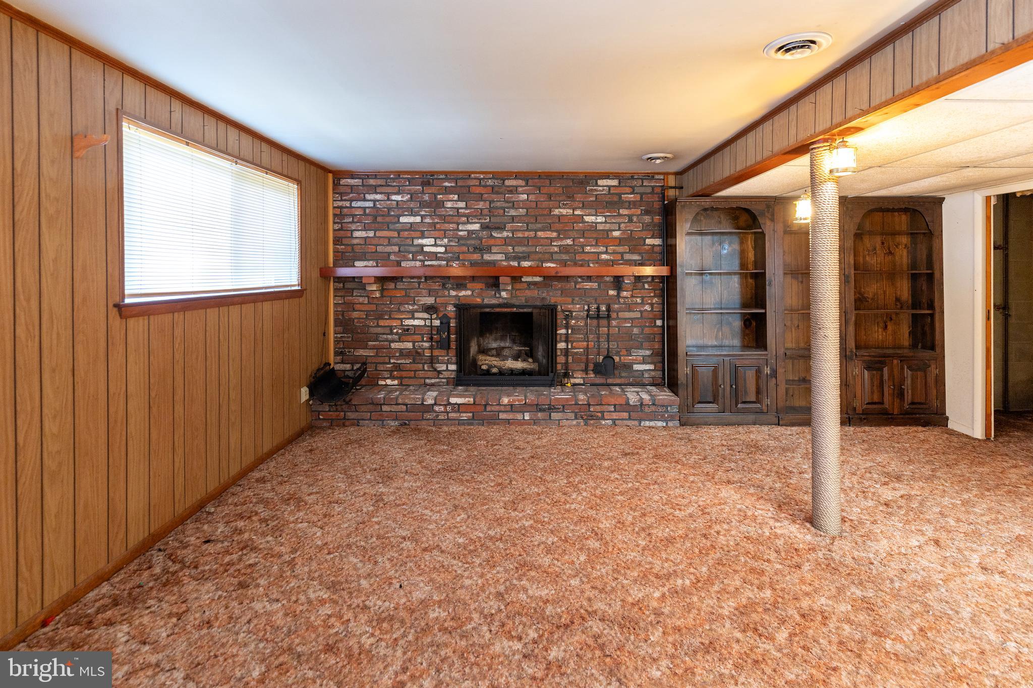 78 Diamond Avenue Pine Hill, NJ 08021 - Photo 24 of 36 a view of an empty room with a fireplace and a window