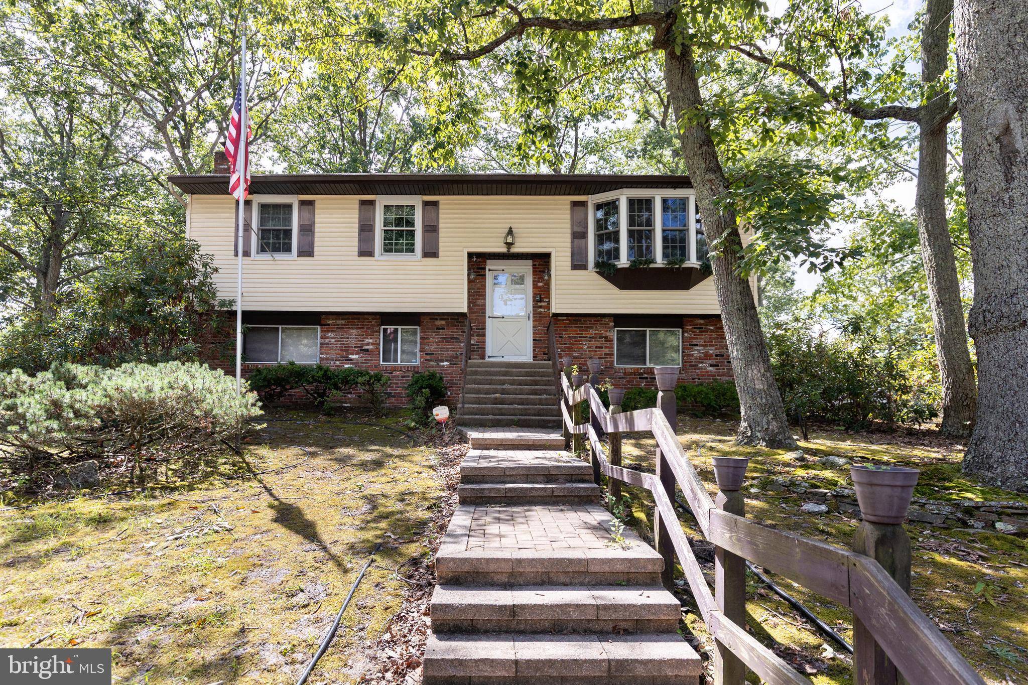 78 Diamond Avenue Pine Hill, NJ 08021 - Photo 3 of 36 a view of a patio with table and chairs with wooden fence and plants