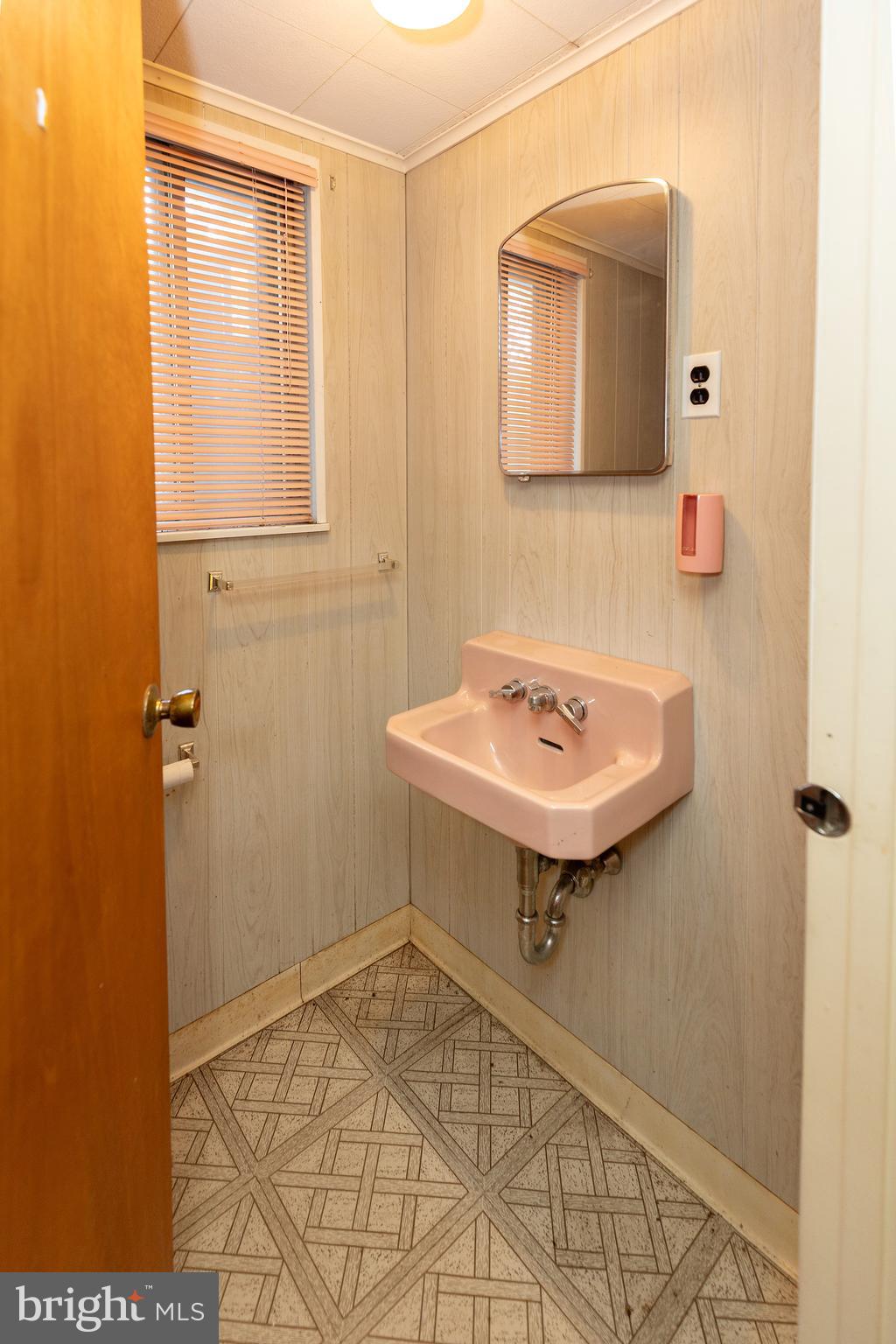 78 Diamond Avenue Pine Hill, NJ 08021 - Photo 33 of 36 a bathroom with a sink and a mirror