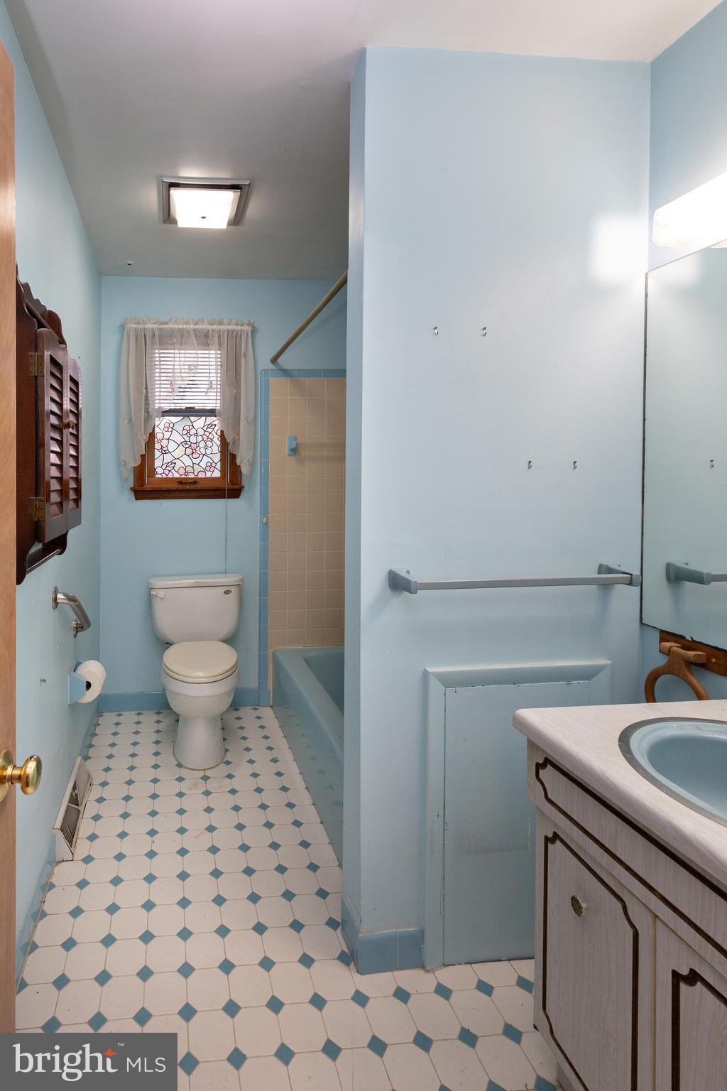 78 Diamond Avenue Pine Hill, NJ 08021 - Photo 34 of 36 a bathroom with a sink a toilet a mirror and shower