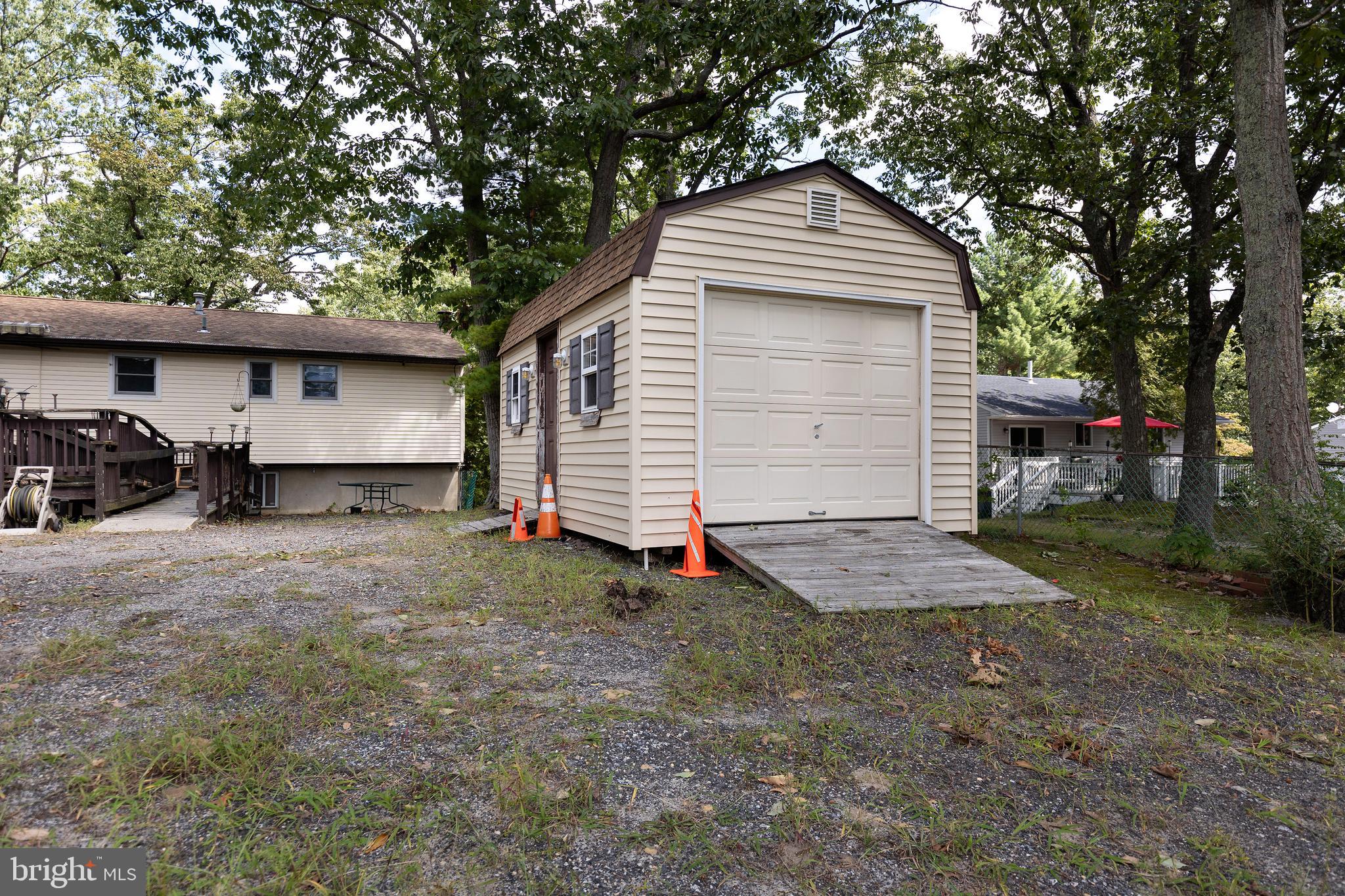 78 Diamond Avenue Pine Hill, NJ 08021 - Photo 36 of 36 a front view of a house with a yard and garage