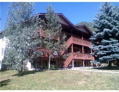 1885 Buffehr Creek Road, Unit 2 Vail, CO 81657 - Photo 2 of 6 a front view of a house with a yard