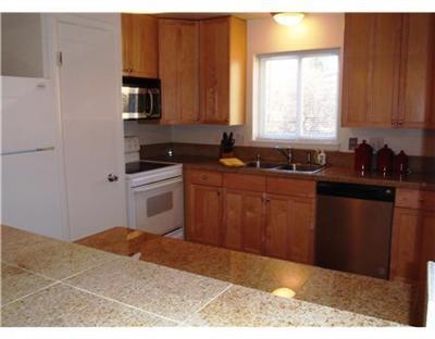 1885 Buffehr Creek Road, Unit 2 Vail, CO 81657 - Photo 3 of 6 a kitchen with a sink stove and microwave