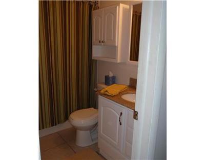 1885 Buffehr Creek Road, Unit 2 Vail, CO 81657 - Photo 4 of 6 a bathroom with a granite countertop sink and a toilet