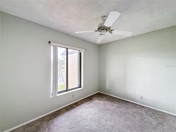 a bathroom with a sink a toilet a mirror and shower