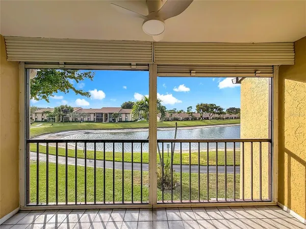 a view of a porch with wooden floor and stairs