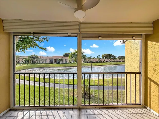 a view of a porch with wooden floor and stairs