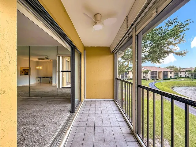 a view of a livingroom with wooden floor and a flat screen tv