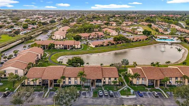 a large kitchen with white cabinets and a stove top oven