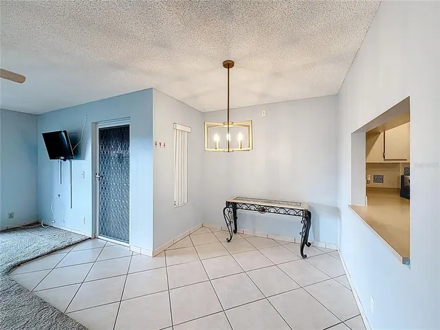 an empty room with a empty space and windows