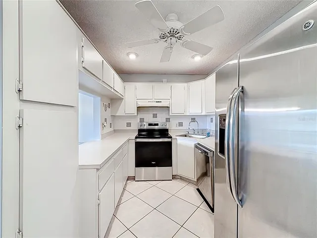an aerial view of residential houses and city view