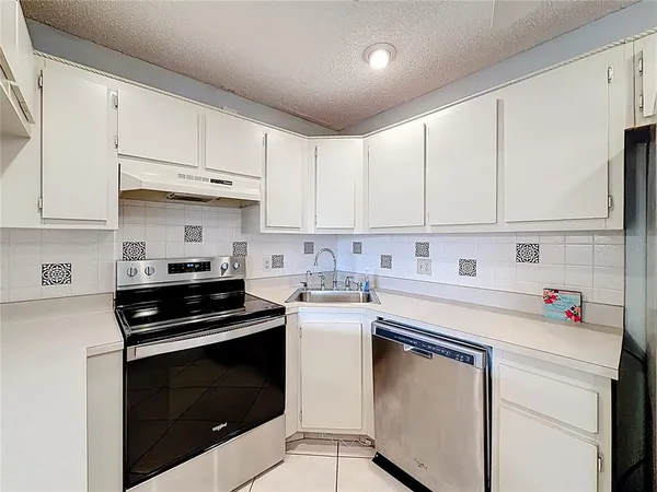 an aerial view of a city with lawn chairs