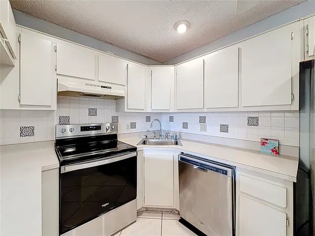 an aerial view of a city with lawn chairs