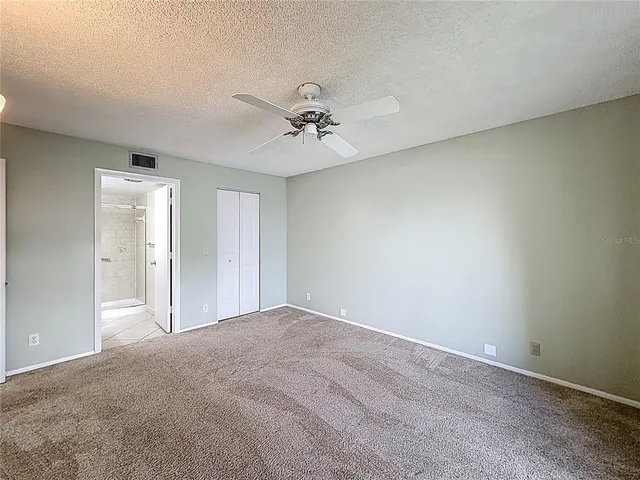 a view of a staircase with white walls