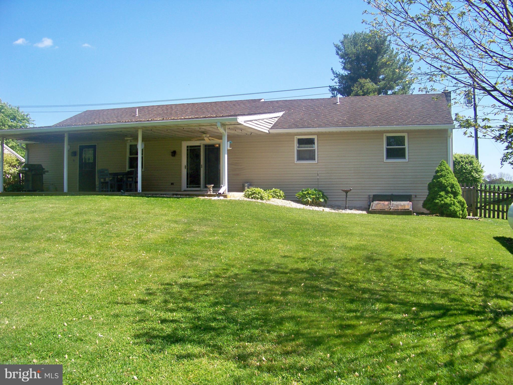 32 Green Acre Road Lititz, PA 17543 - Photo 4 of 21 a front view of a house with a yard and garage