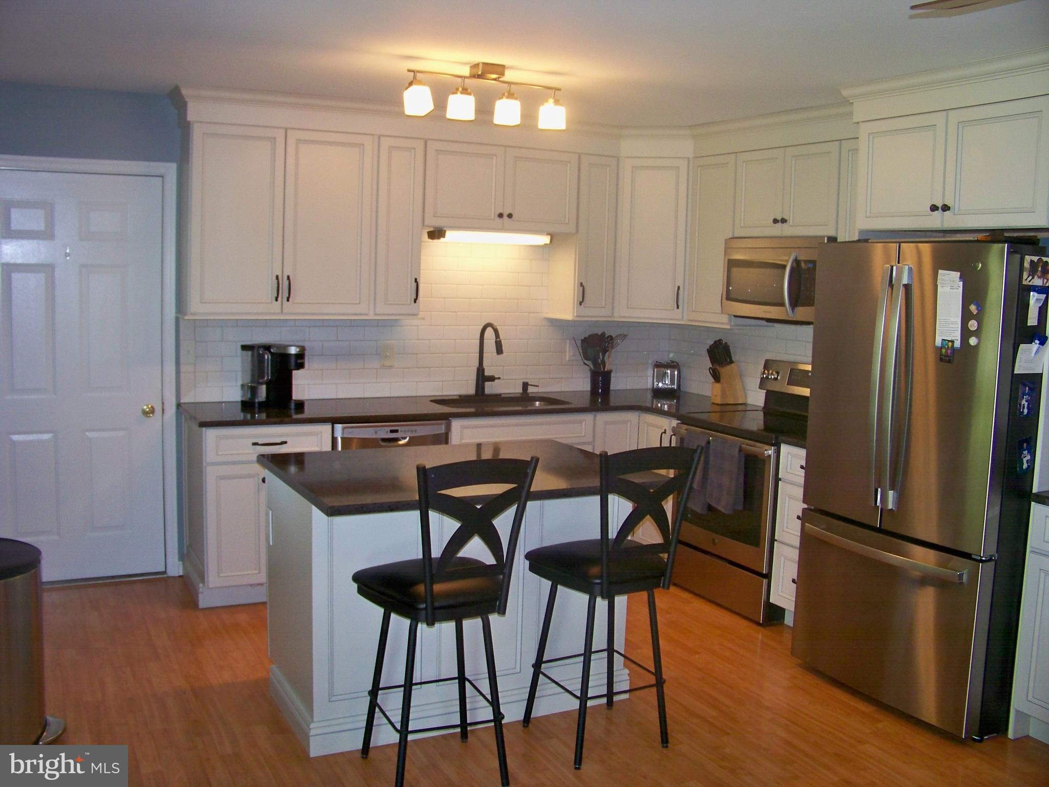 32 Green Acre Road Lititz, PA 17543 - Photo 8 of 21 a kitchen with stainless steel appliances a refrigerator stove microwave and cabinets
