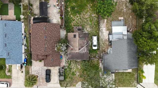 an aerial view of a house with outdoor space and street view