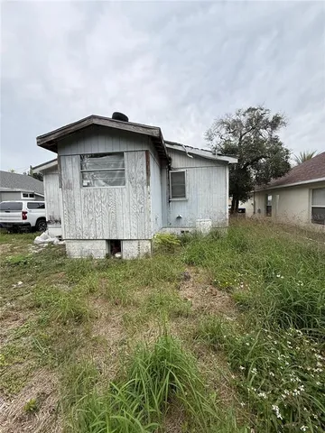 a house with trees in the background