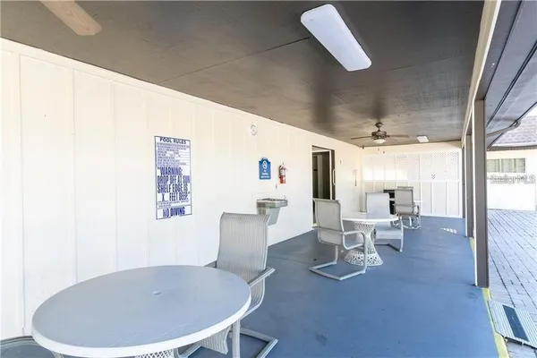a view of a chair and table on the wooden floor