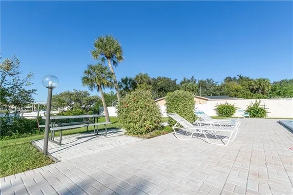 a view of a swimming pool and lounge chair