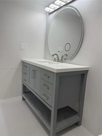 a bathroom with a toilet and a bath tub