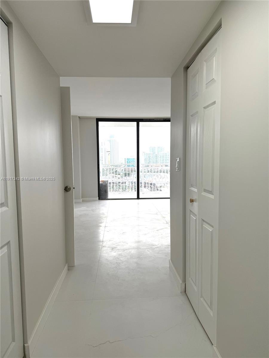 210 174th Street, Unit 1804 Sunny Isles Beach, FL 33160 - Photo 8 of 31 a view of an empty room with a window