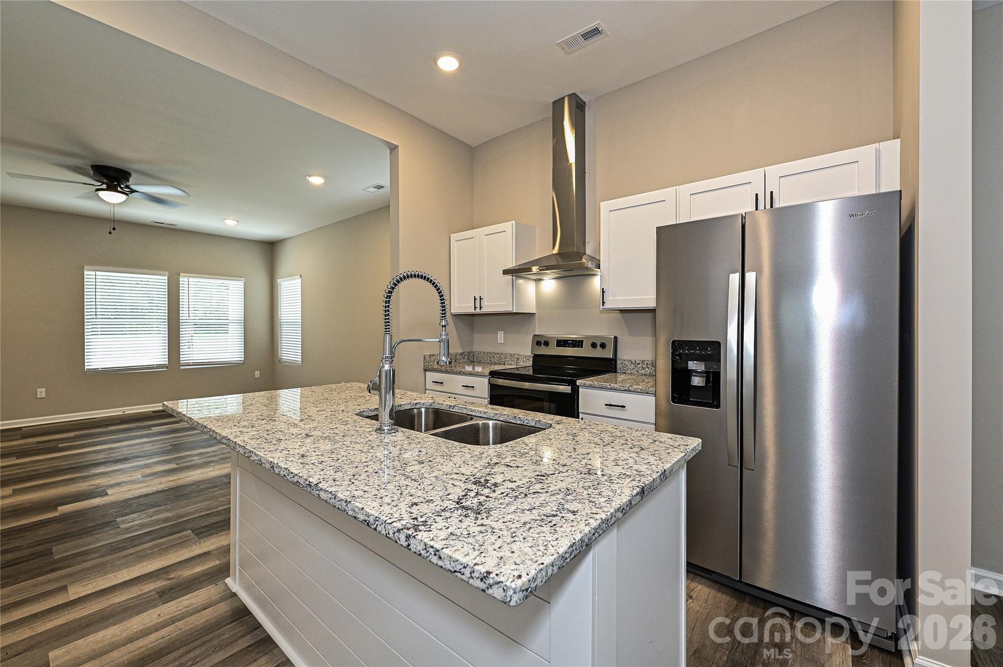 624 Harrison Street Rock Hill, SC 29730 - Photo 11 of 25 a kitchen with granite countertop kitchen island stainless steel appliances a sink stove and refrigerator