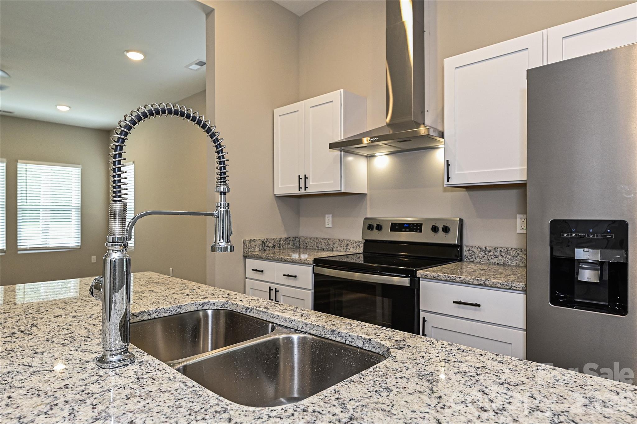 624 Harrison Street Rock Hill, SC 29730 - Photo 12 of 25 a kitchen with a stove a sink and a microwave