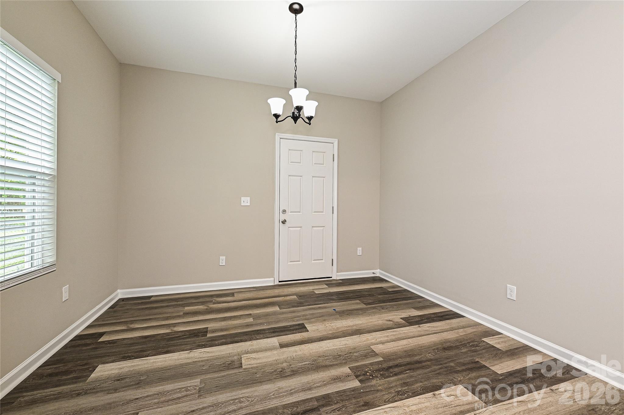 624 Harrison Street Rock Hill, SC 29730 - Photo 14 of 25 a view of a chandelier fan and wooden floor