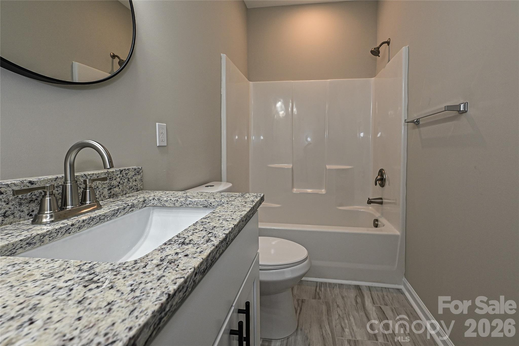 624 Harrison Street Rock Hill, SC 29730 - Photo 19 of 25 a bathroom with a granite countertop sink a toilet and bathtub