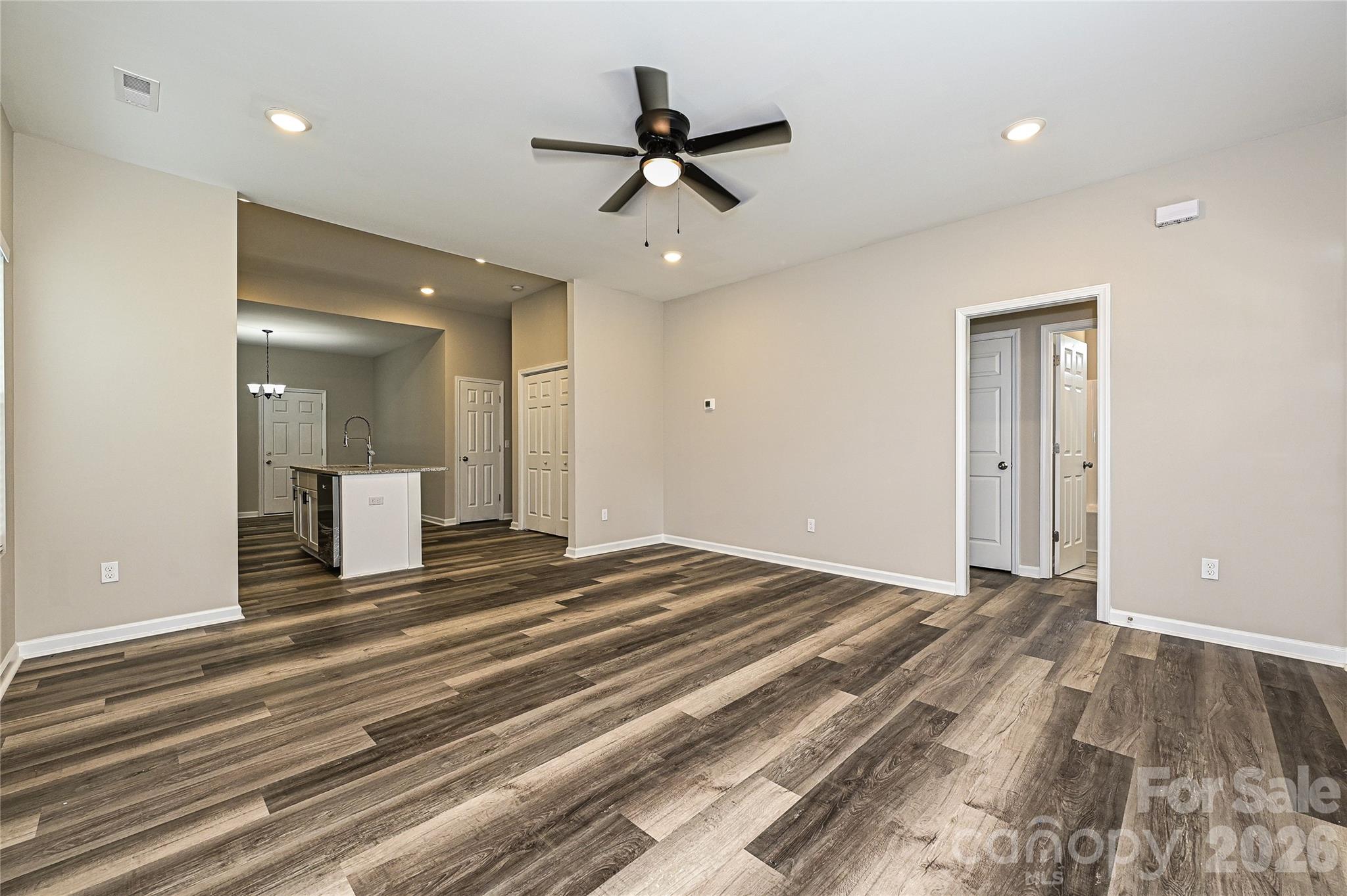 624 Harrison Street Rock Hill, SC 29730 - Photo 6 of 25 a view of a livingroom with a hardwood floor and a ceiling fan