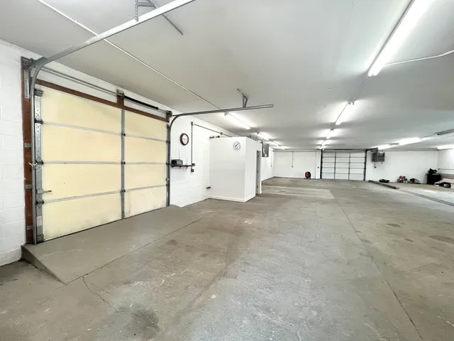 a large hall with a lot of gym equipment