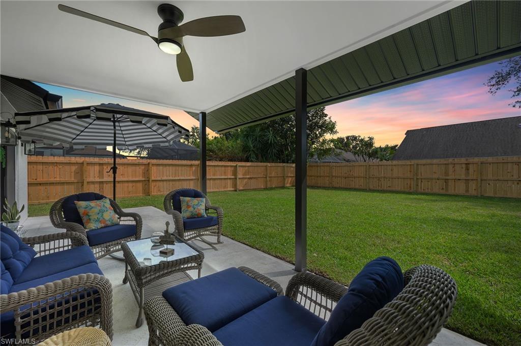10274 Boca Circle Naples, FL 34109 - Photo 20 of 26 a view of a yard with furniture