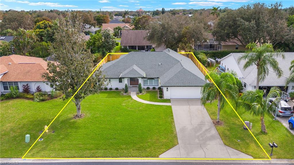 10274 Boca Circle Naples, FL 34109 - Photo 3 of 26 an aerial view of a house