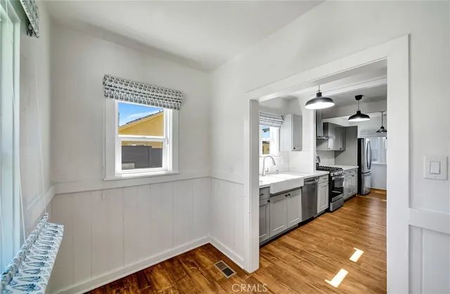 a kitchen with stainless steel appliances granite countertop a sink and cabinets