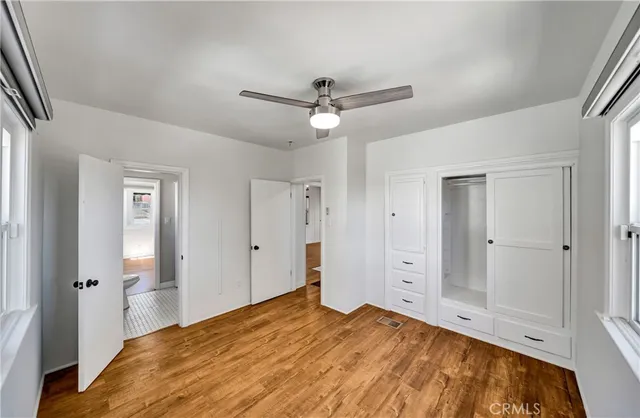 a bedroom with a large bed and closet