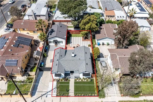 an aerial view of houses with outdoor space