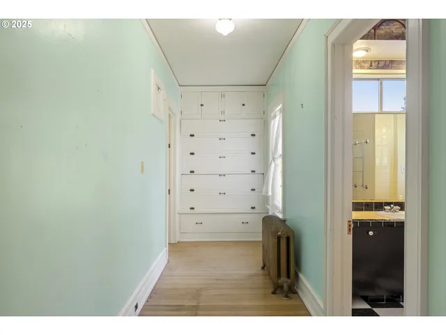 a view of an entryway with wooden floor