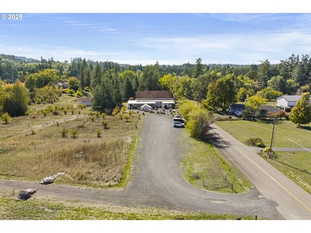 a aerial view of a house with a big yard
