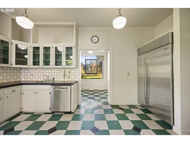 a spacious bathroom with a sink a mirror and a shower