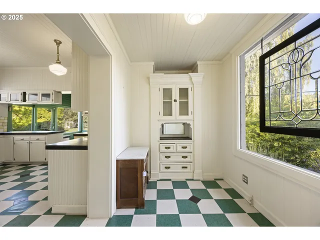 a kitchen with a checkered floor and a black white checkered floor