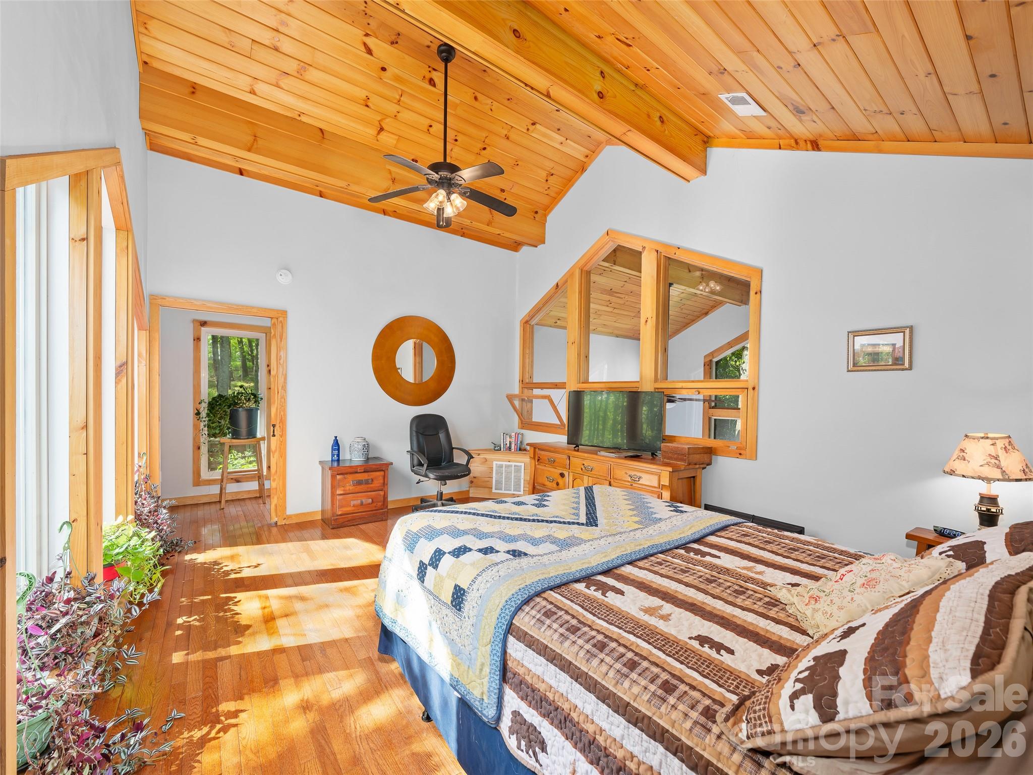 228 Continental Divide Road Spruce Pine, NC 28777 - Photo 18 of 48 a bedroom with bed and a window