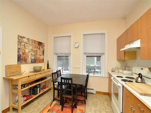 12 Kilsyth Road, Unit 1 Brookline, MA 02445 - Photo 8 of 9 a view of a dining room with furniture and a kitchen