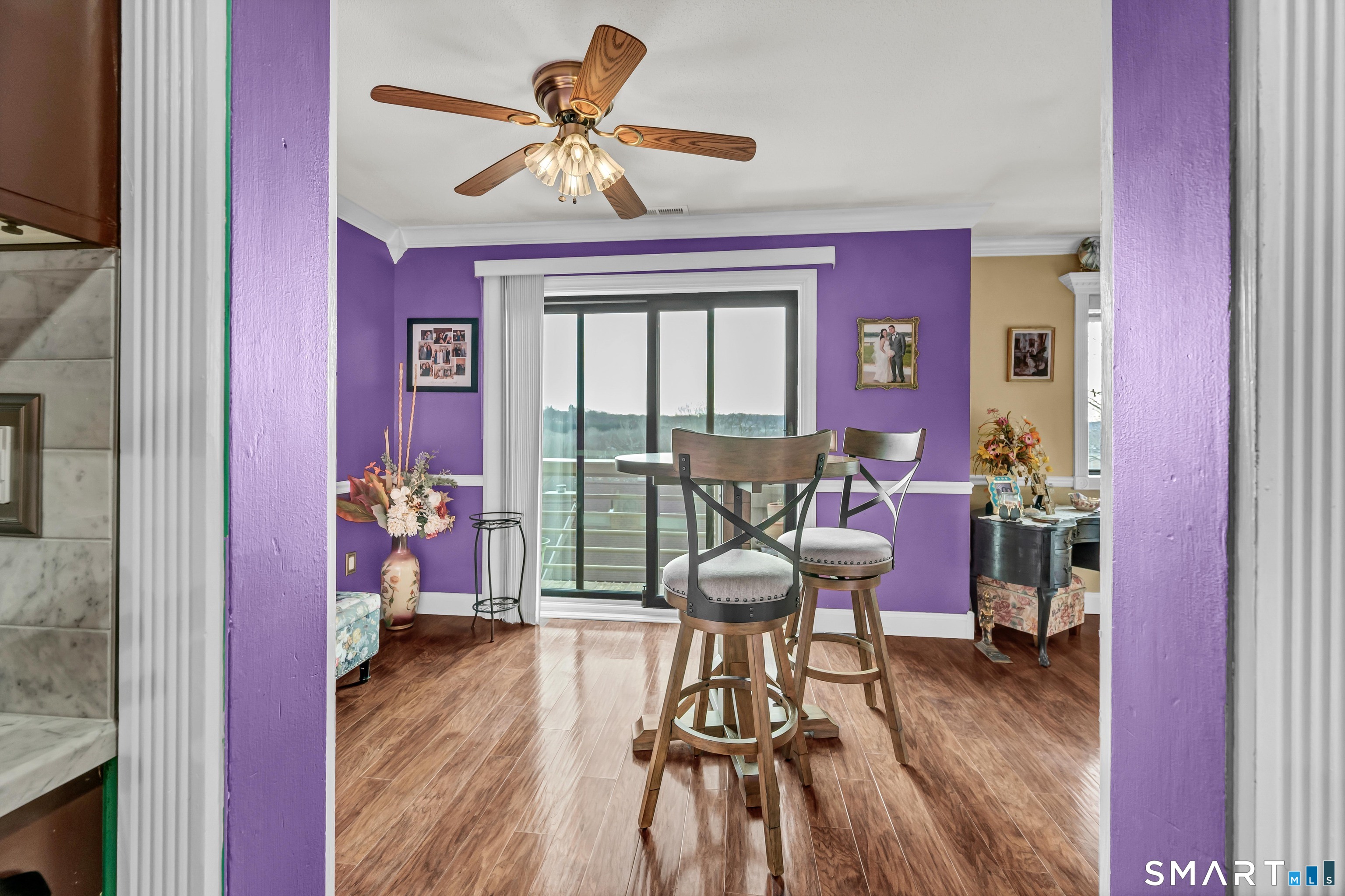 166 Old Brookfield Road, Unit 18A6 Danbury, CT 06811 - Photo 11 of 19 a view of a dining room with furniture window and wooden floor