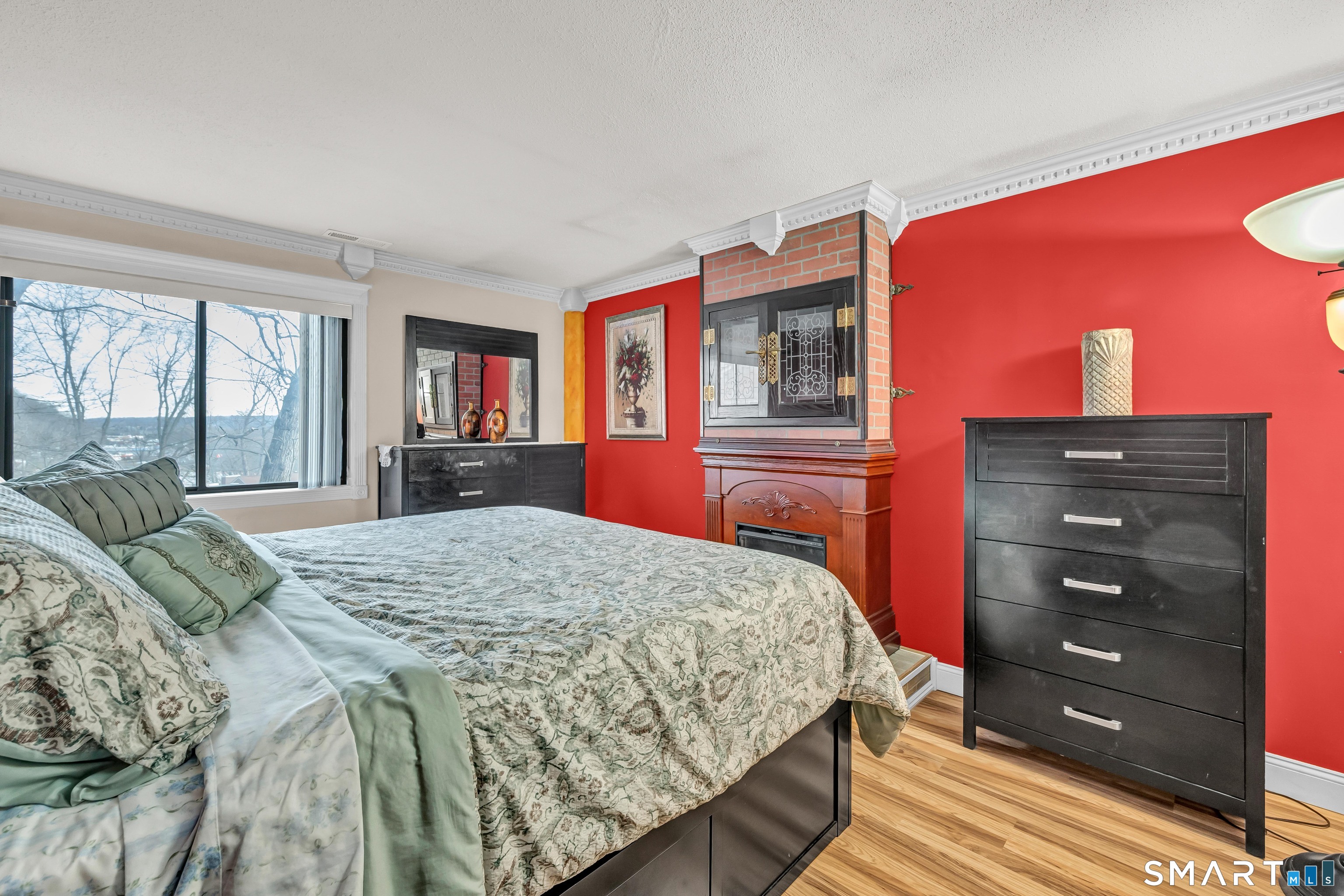 166 Old Brookfield Road, Unit 18A6 Danbury, CT 06811 - Photo 13 of 19 a bedroom with a bed and a dresser
