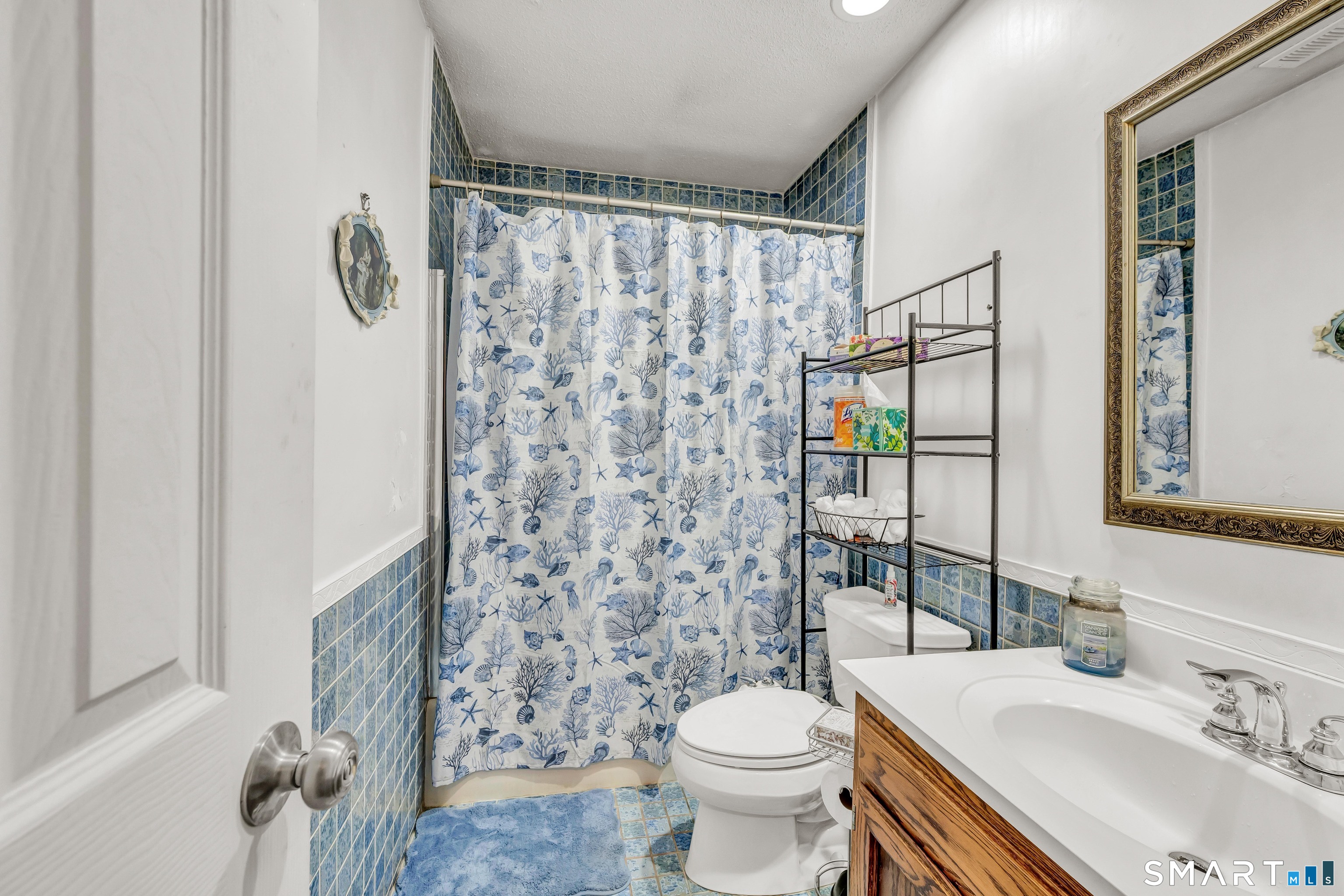 166 Old Brookfield Road, Unit 18A6 Danbury, CT 06811 - Photo 14 of 19 a bathroom with a sink toilet and shower