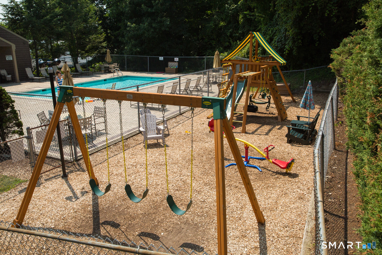166 Old Brookfield Road, Unit 18A6 Danbury, CT 06811 - Photo 17 of 19 swimming pool view with a garden space