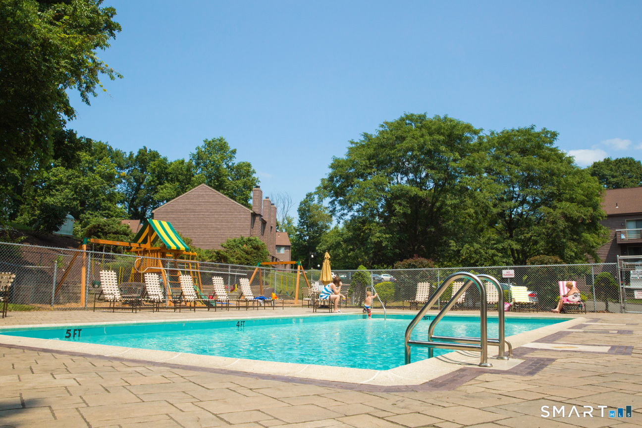 166 Old Brookfield Road, Unit 18A6 Danbury, CT 06811 - Photo 18 of 19 a house view with a garden space
