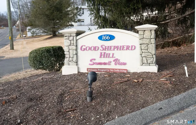 a sign on the side of the road